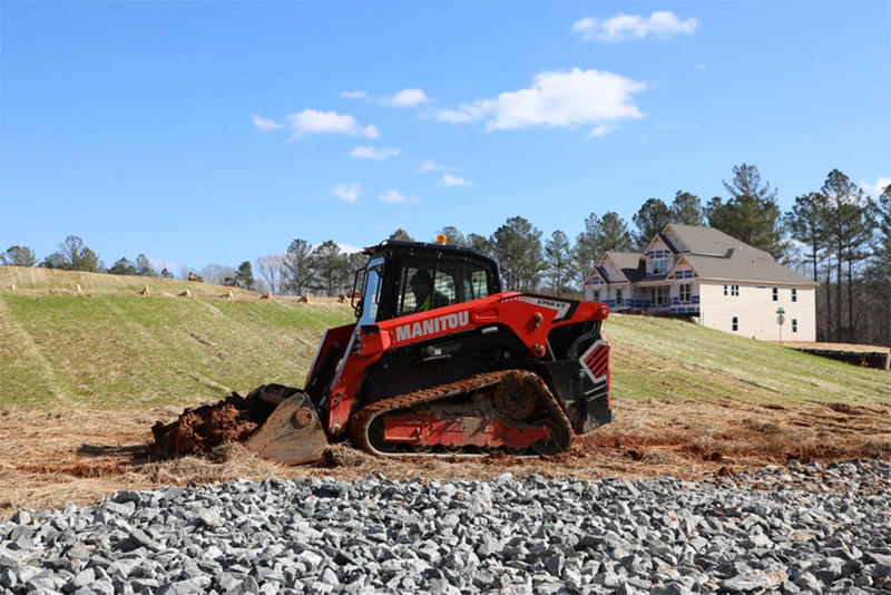 Manitou compact track loader completing sitework.